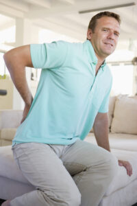 man-with back pain bending over